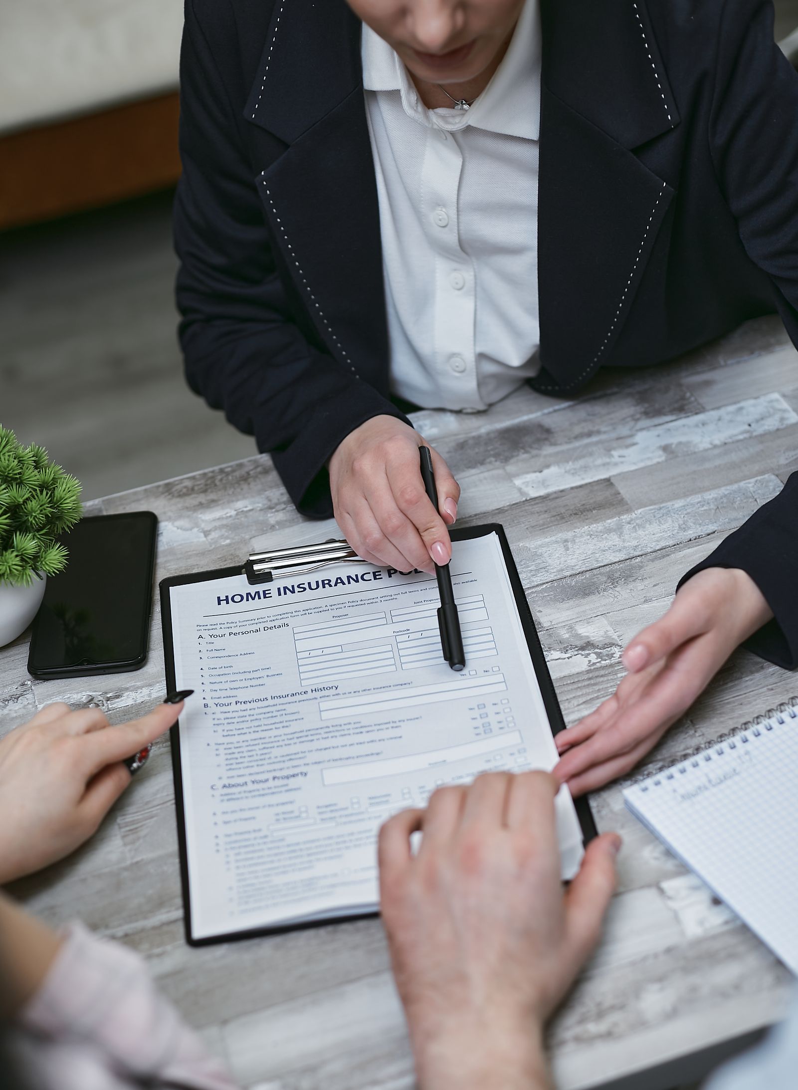 Insurance advisor reviewing coverage with clients